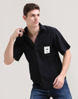 Night Shadow: Solid Black Oversized Half Sleeve Double Pocket Shirt